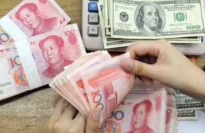 Yuan weakens, dollar holds steady as markets anticipate Fed delay